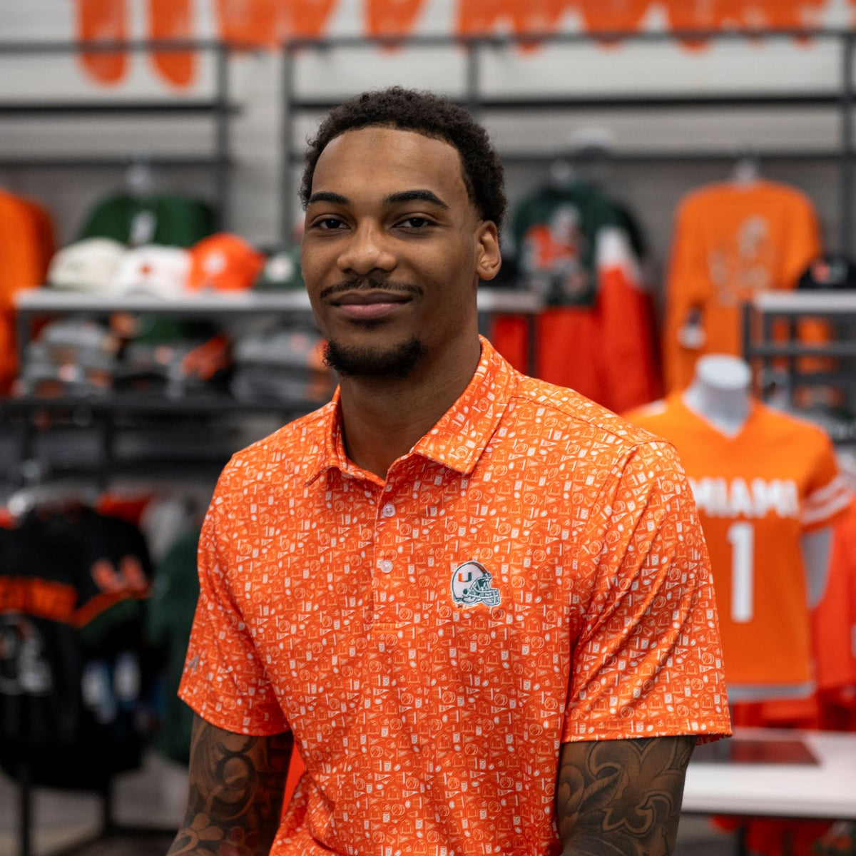 Antigua Miami Hurricanes Orange Football Allover Print Polo